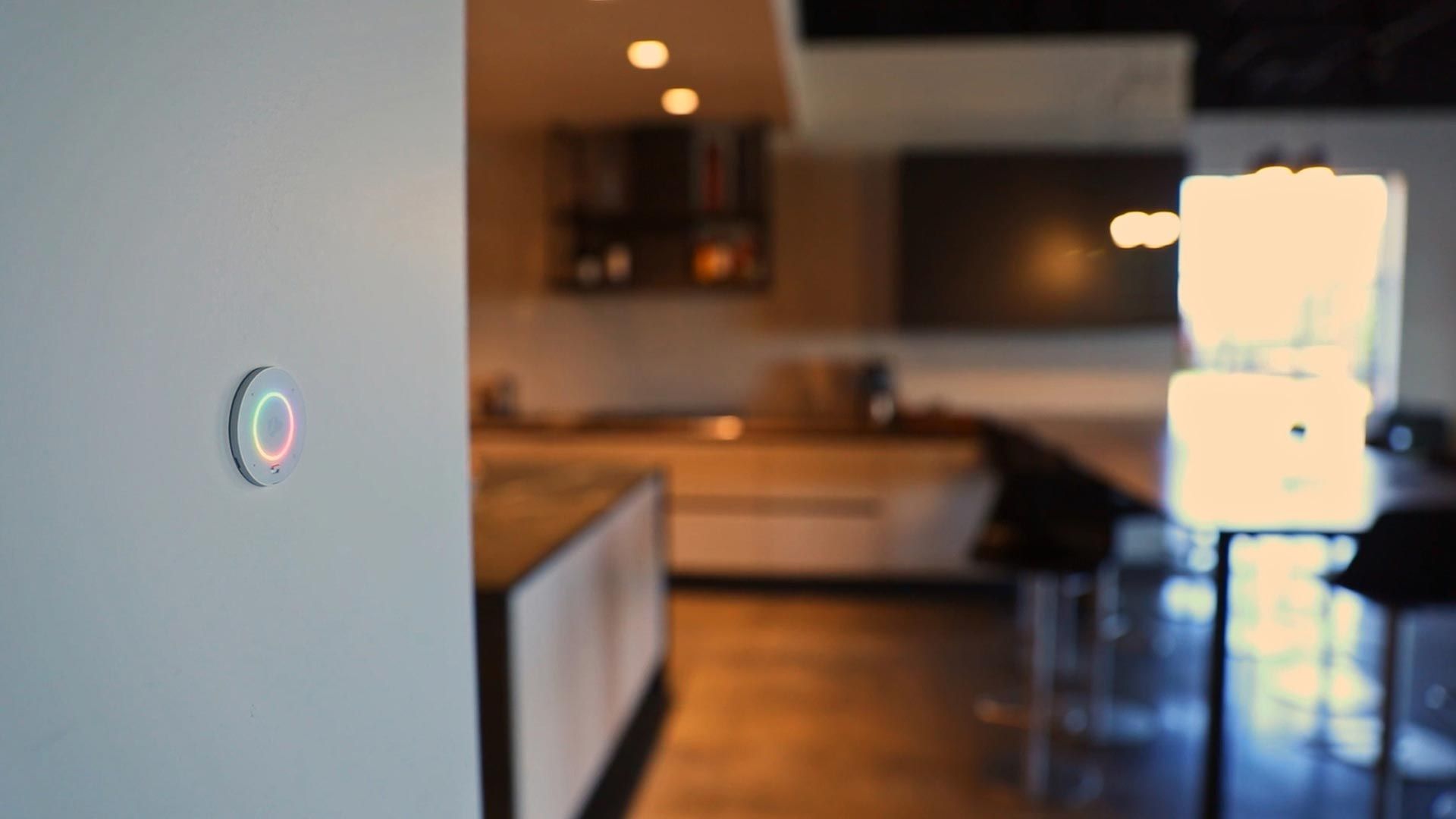 Smart home voice control button on a wall in a modern kitchen